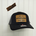 Black trucker hat with 'Make the Steelers Great Again' patch on a white background
